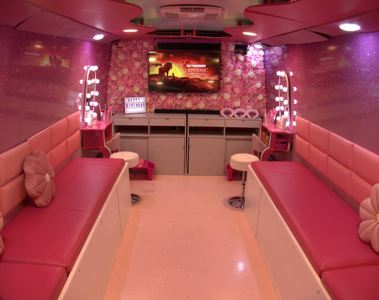 Inside the Pink Spa Bus — glam mirror stations