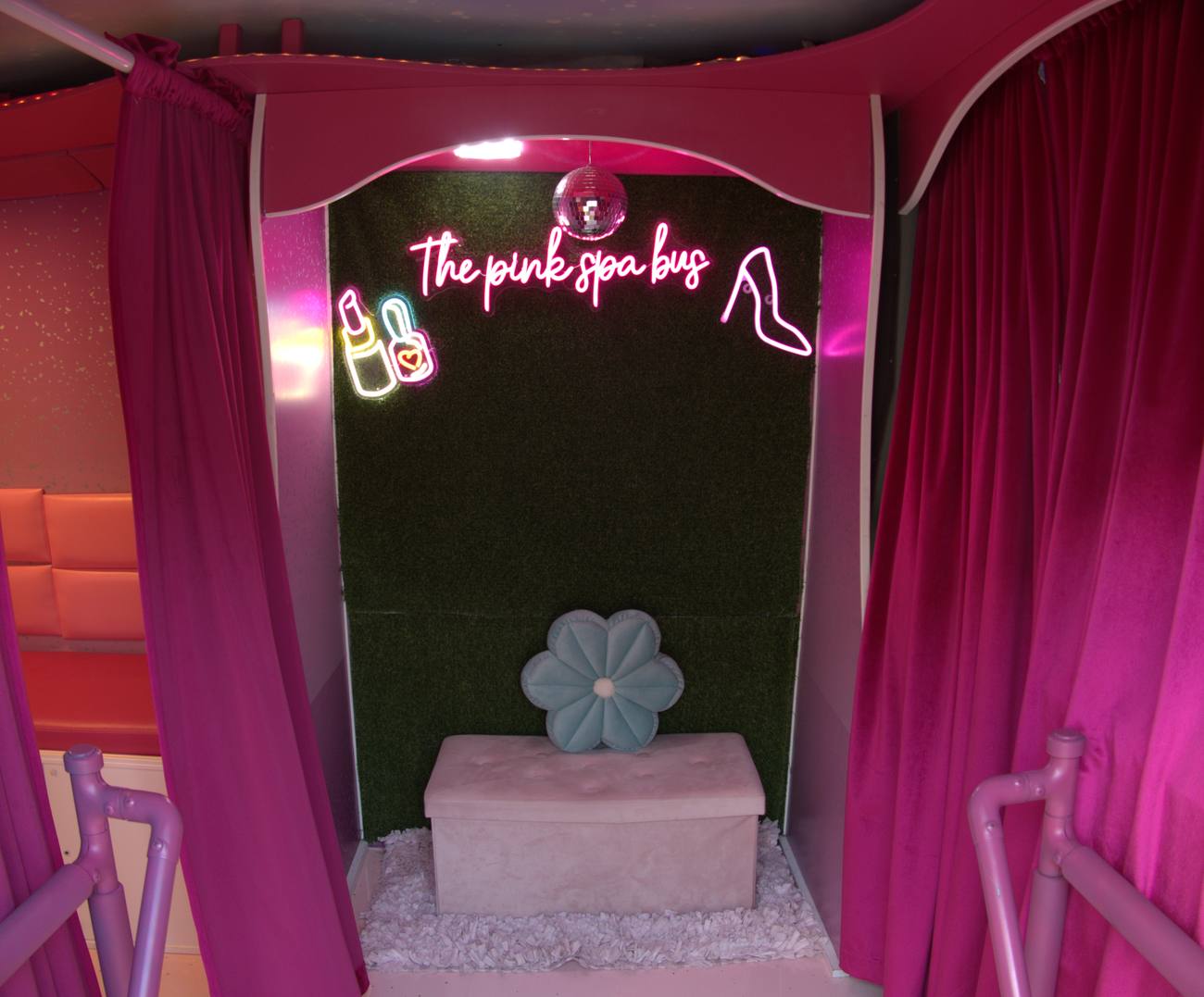 Inside the bus — neon glam lounge
