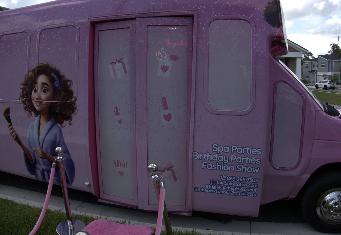 The Pink Spa Bus — fully wrapped exterior