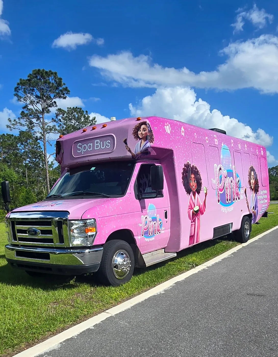 The Pink Spa Bus — fully wrapped pink exterior