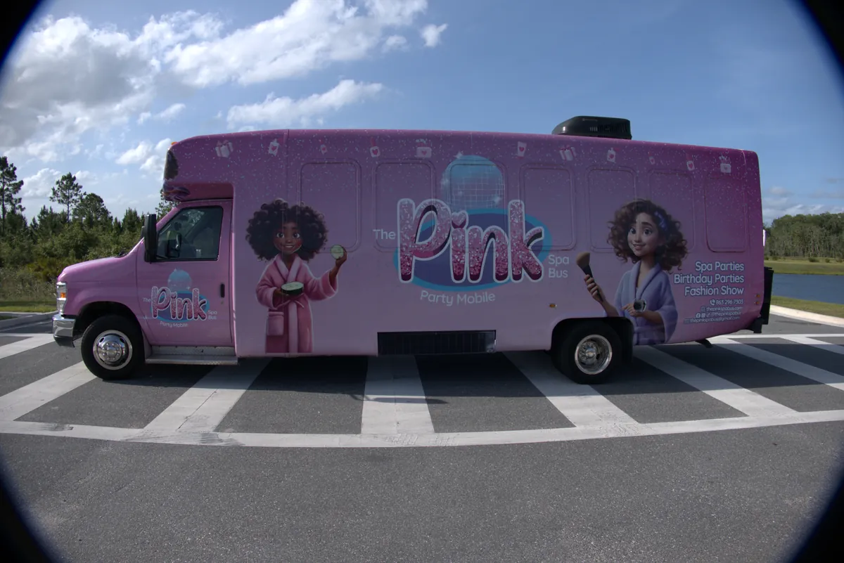The Pink Spa Bus — fully wrapped pink exterior